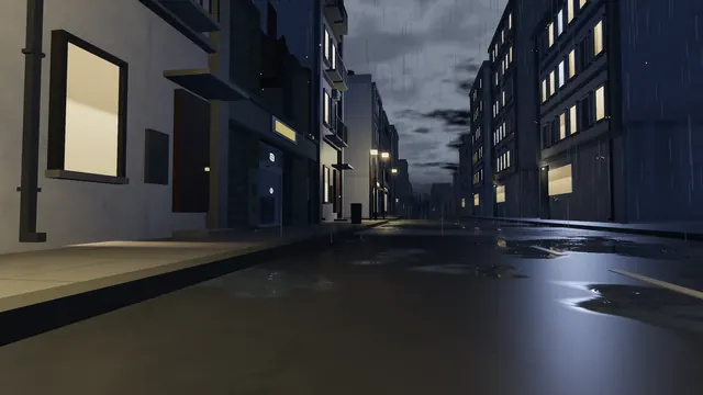 A wet street at night between tall buildings